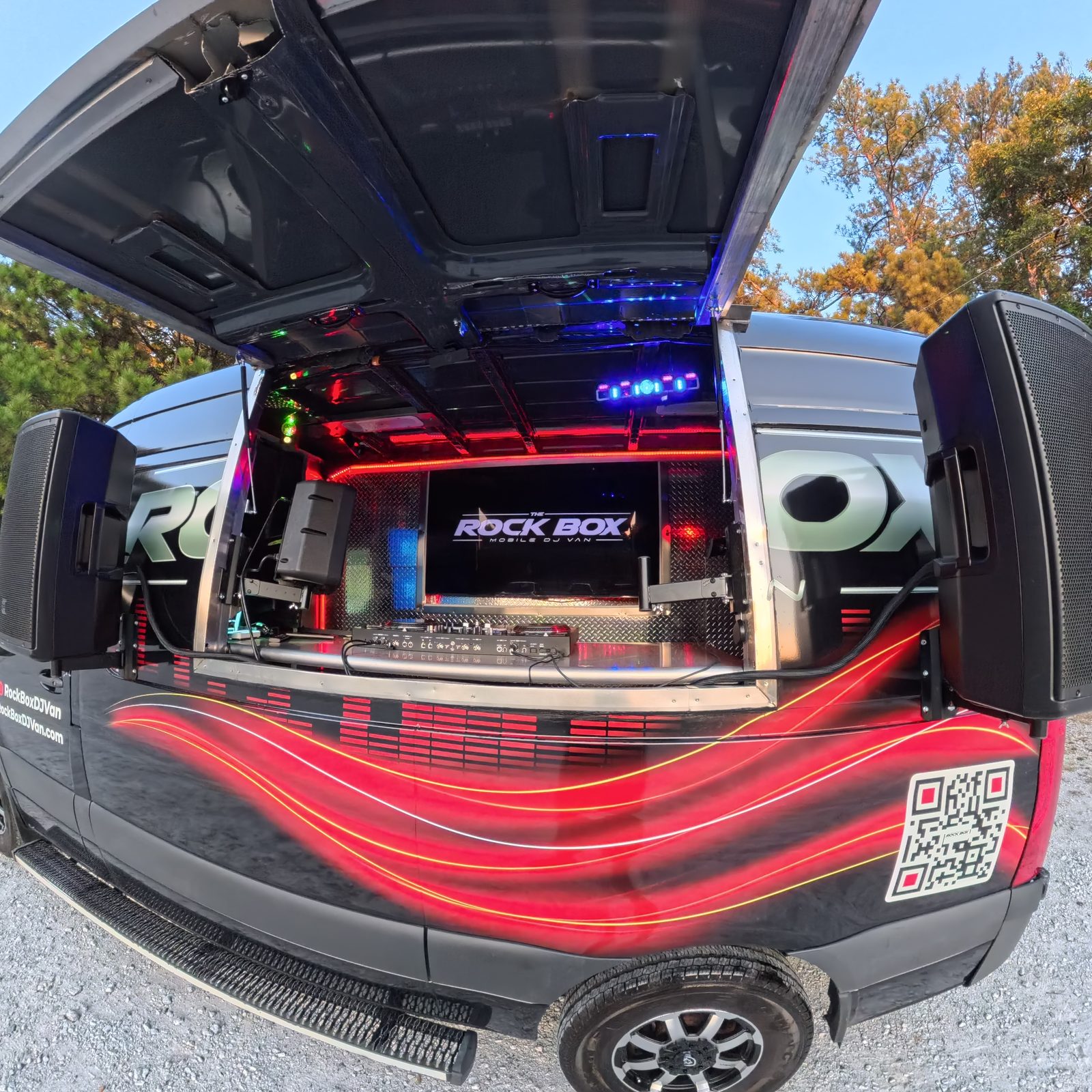 The Rock Box mobile DJ van open and lit up with red LED interior lighting