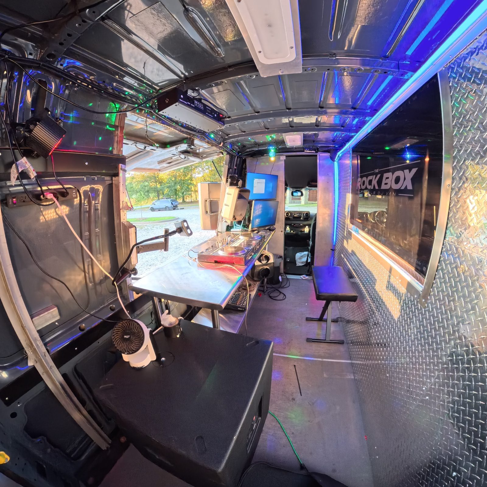 Interior of The Rock Box DJ van glowing with colorful LED lighting