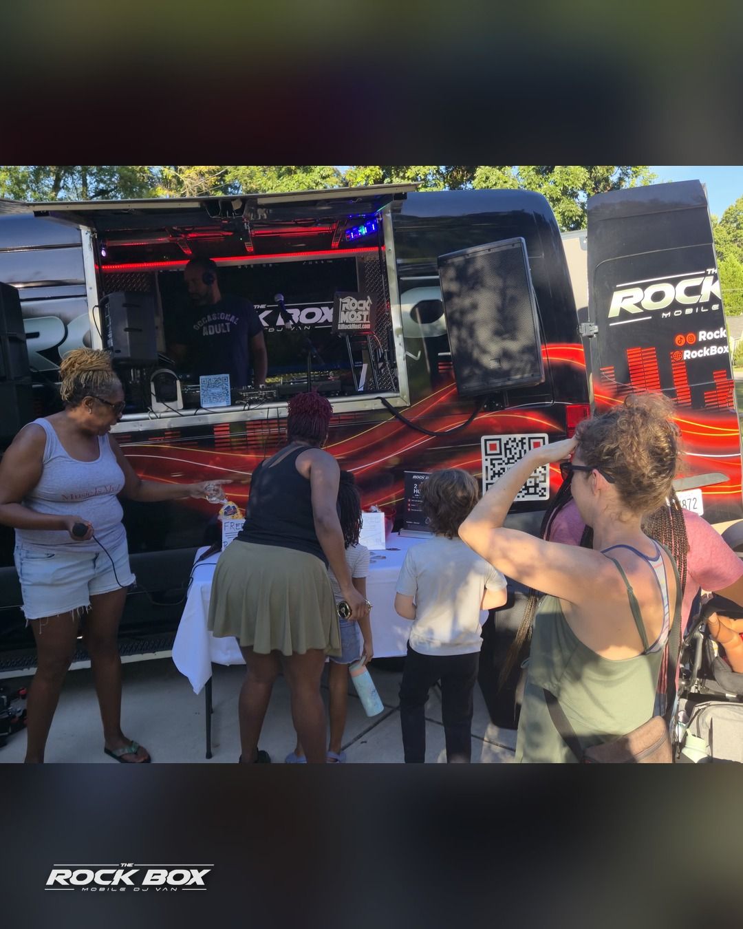 The Rock Box mobile DJ van at an event
